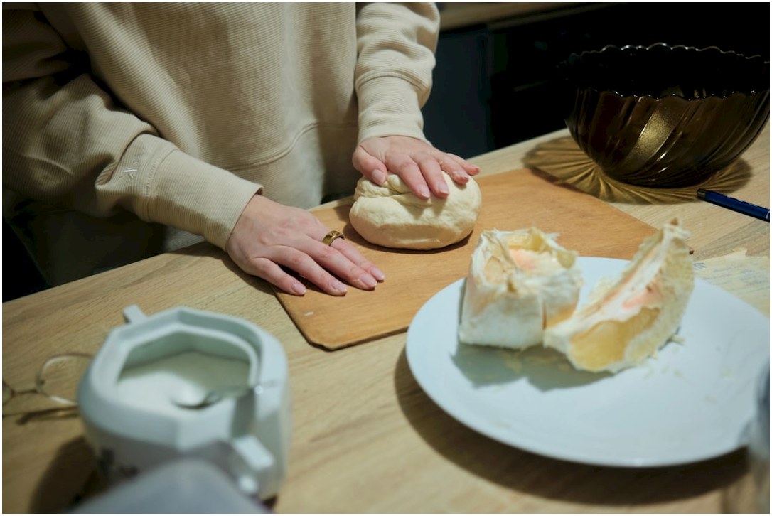 A person sitting at a table with a plate of food