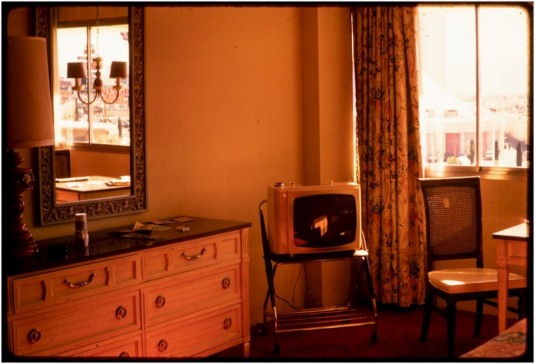 Retro television set on a stand in a vintage room.